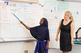 Student at Board with Teacher