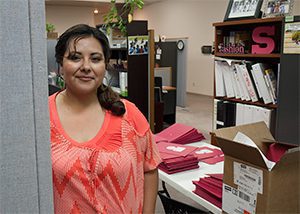 Micaela Razo preps for a parent and family engagement day.