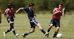 Students playing soccer - League of Education Voters